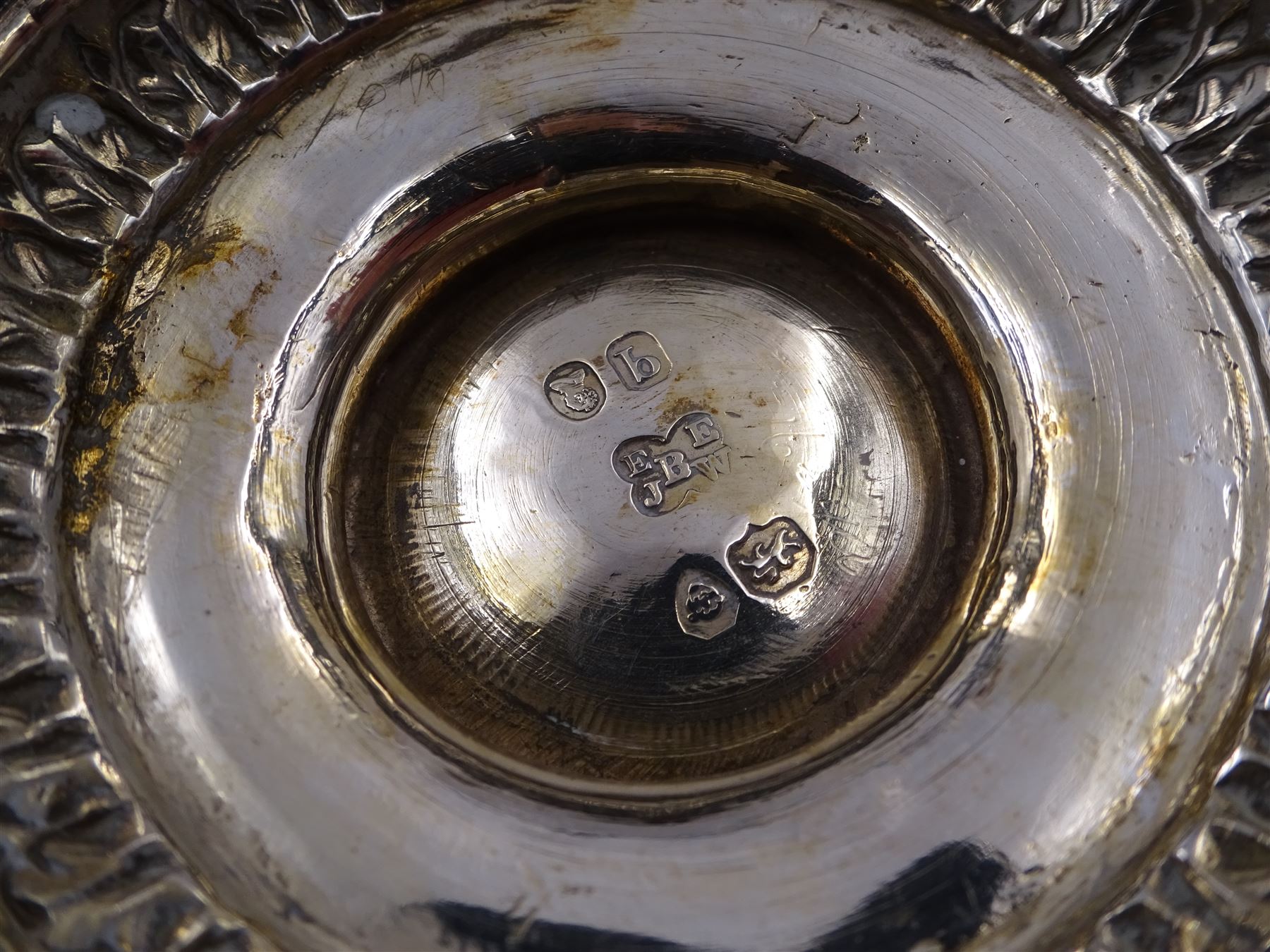 William IV silver christening mug, of waisted form, the body embossed with game birds in a countryside setting and a blank circular cartouche, with acanthus leaf capped scroll handle, upon a circular stepped foot, hallmarked Edward, Edward junior, John & William Barnard, London 1831, H10.2cm