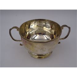 Late Victorian silver twin handled bowl, of plain circular form with two C scroll handles, upon a circular foot, hallmarked John Edward Wilmot, Birmingham 1897, including handles H8cm