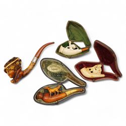 Four meerschaum pipes, with carved figures depicting a deer, horse, lounging gentleman and...