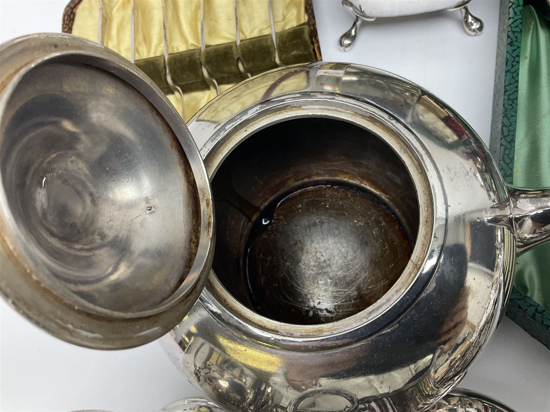 Silver plated four piece tea service, comprising teapot, coffee pot, open sucrier and milk jug, together with card case embossed with animals, flatware etc, 