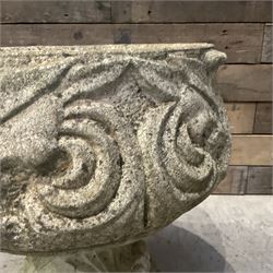 Cast stone circular garden urn decorated with scrolling foliate relief pattern