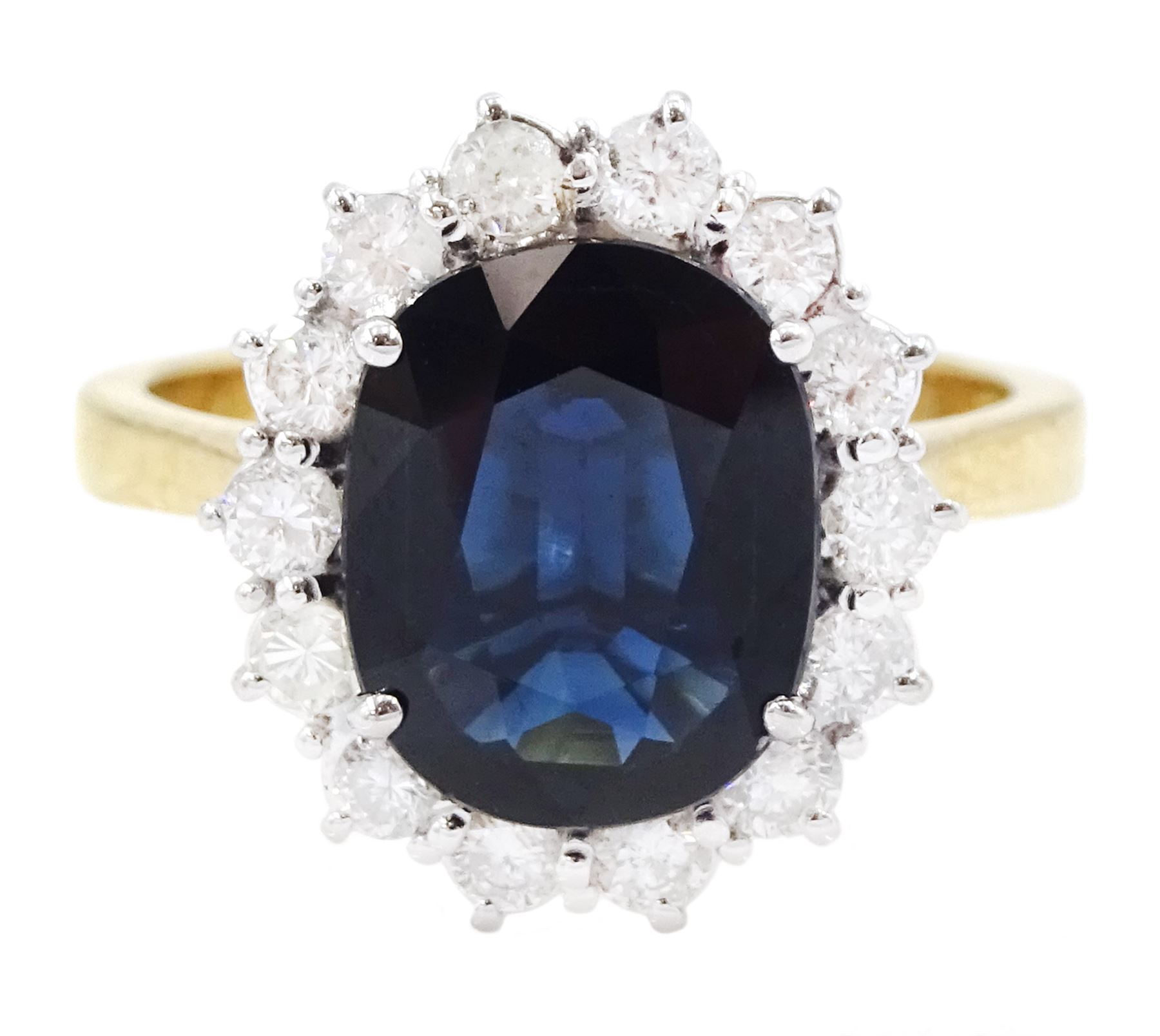 18ct gold oval cut sapphire and round brilliant cut diamond cluster ring, 