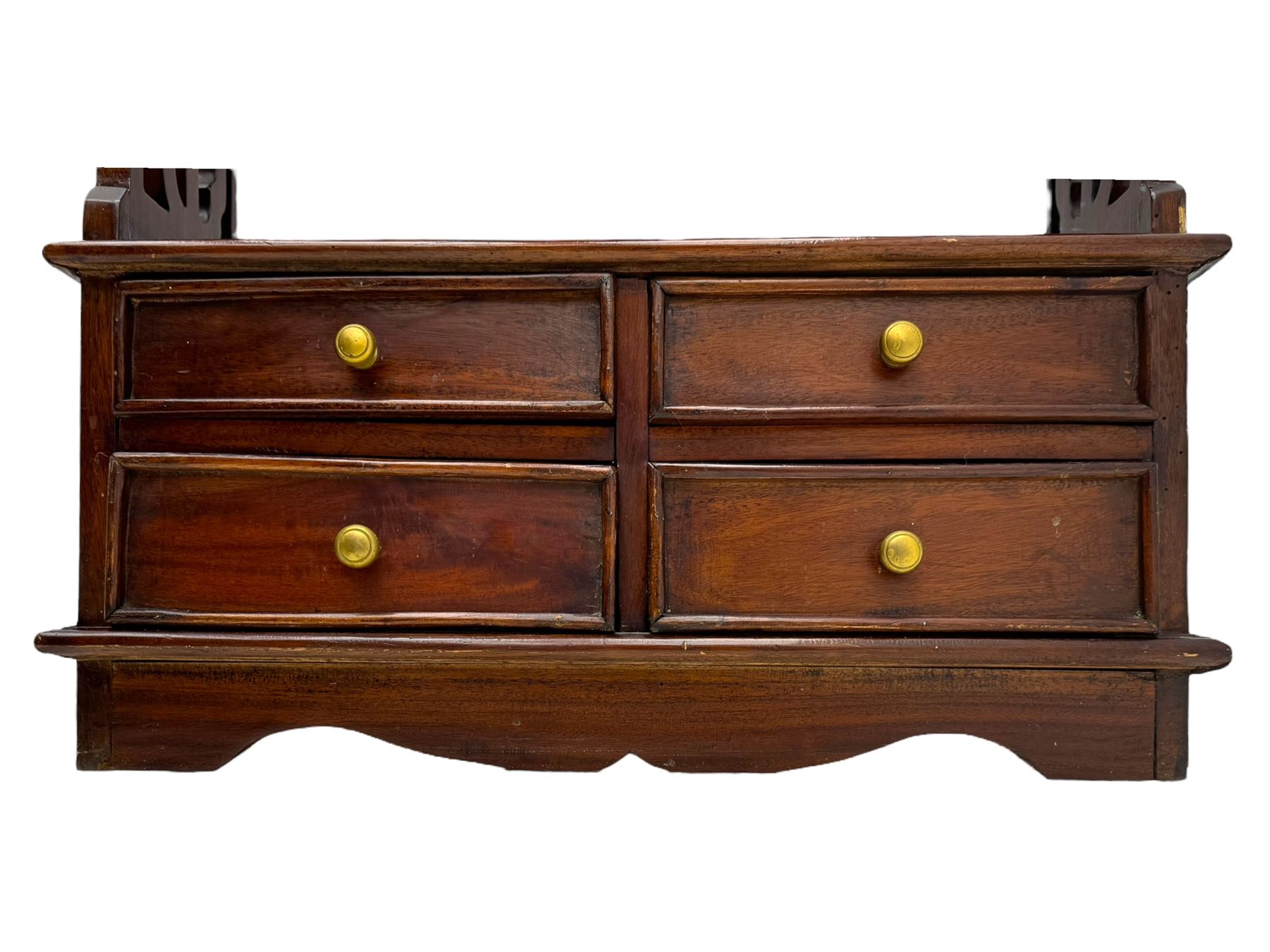 Georgian design mahogany open bookcase, fitted with three open shelves flanked by pierced uprights, with four drawers to the base with scalloped apron