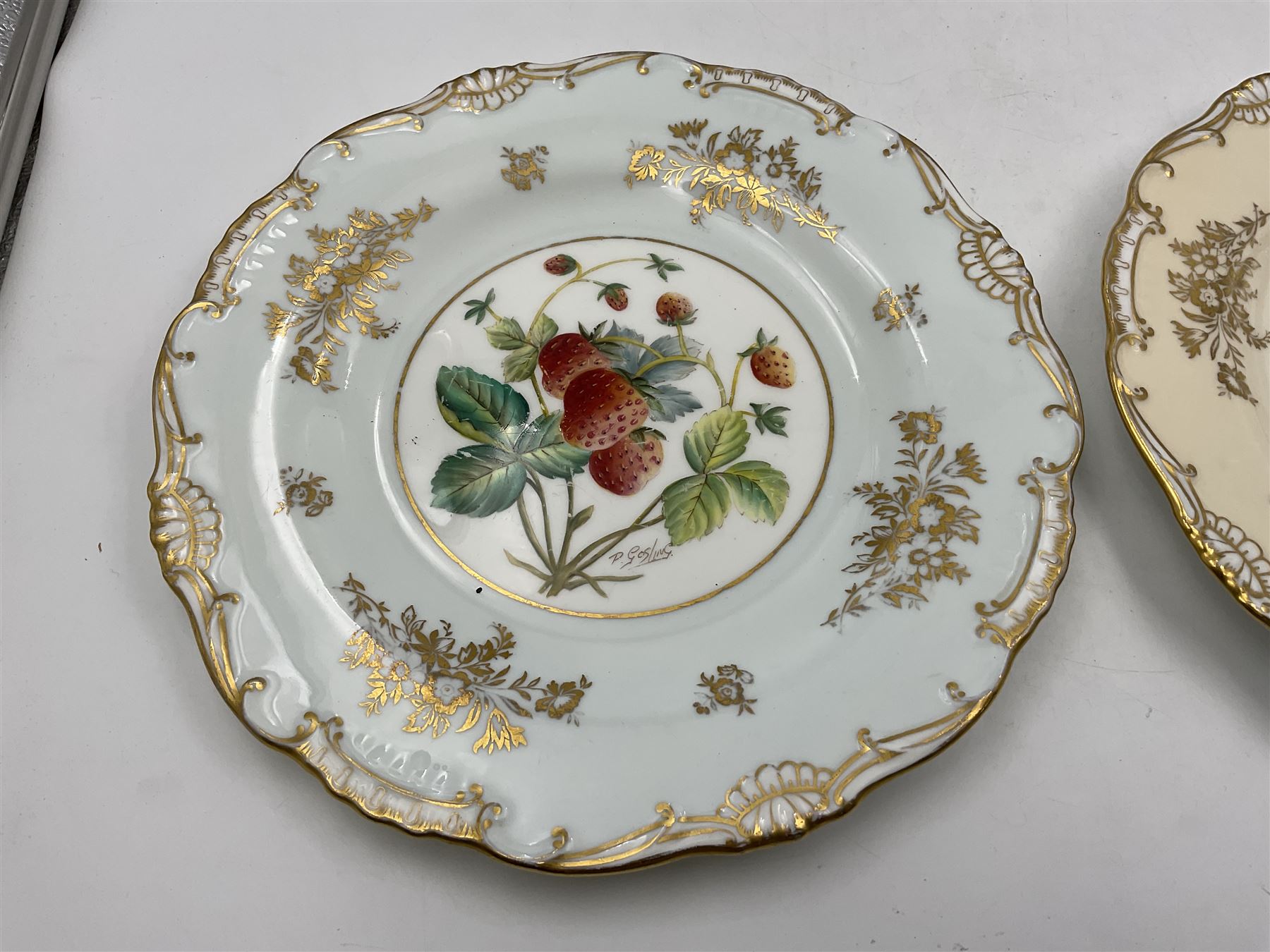 Pair of Minton cabinet plates, with floral gilt decoration and the central hand painted with strawberries, D23cm