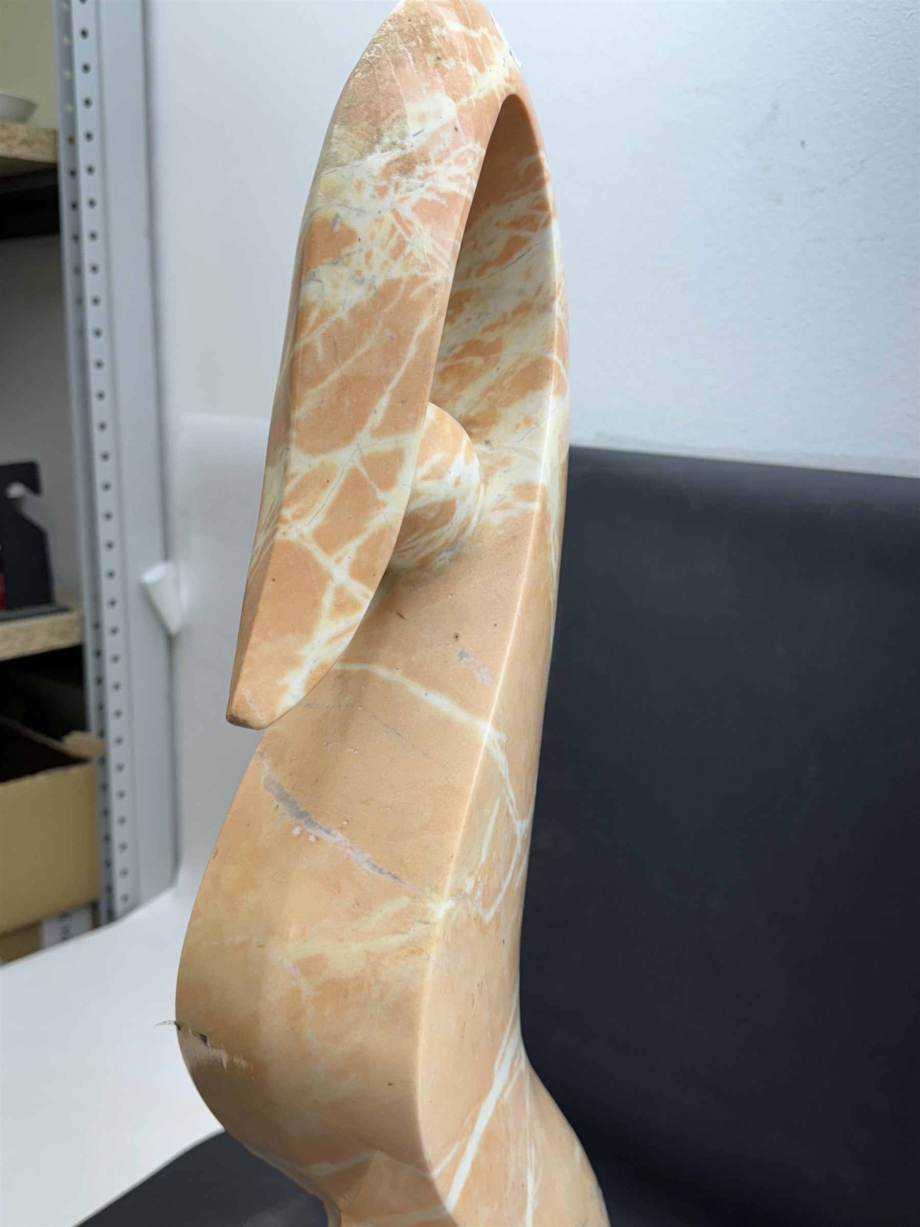 Abstract pink marble sculpture, upon a rectangular base, H63cm