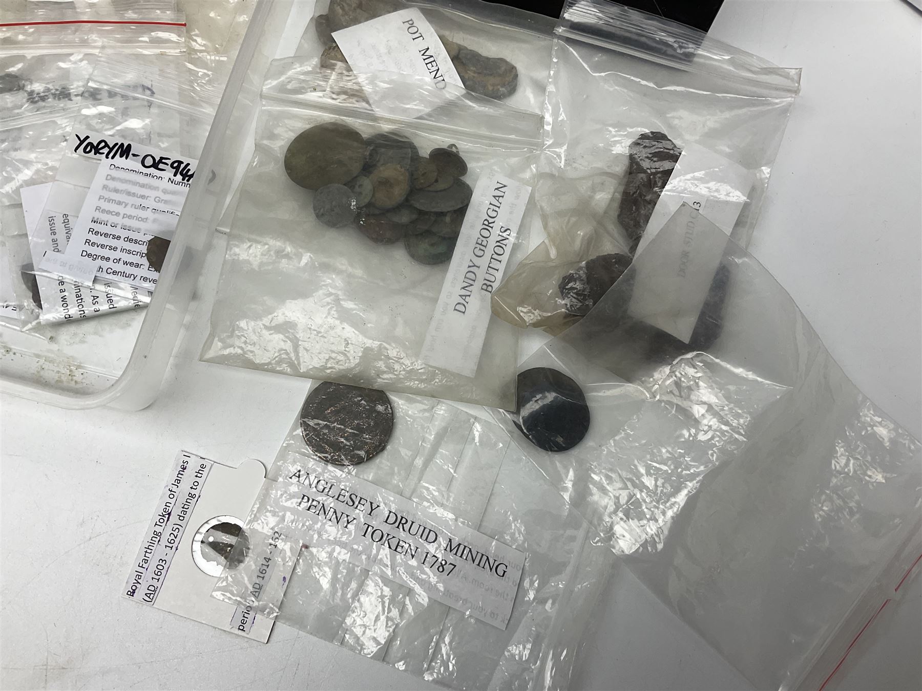 Collection of metal detector finds, to include Neolithic, Roman, medieval  specimens, musket balls, book bindings, tokens, shrapnel etc, 