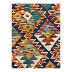 Chobi Kilim multicoloured ground runner, displaying diamond-shaped motifs in shades of blue, red, yellow, and green, accented by a bold black outline and bordered with a striped design, flatwoven with fringed edges