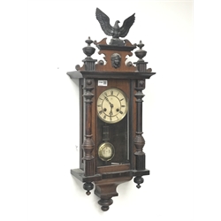  Late 19th century walnut cased Vienna style wall clock, with eagle and final pediment, twin train 'Junghans' movement striking on coil, H82cm  