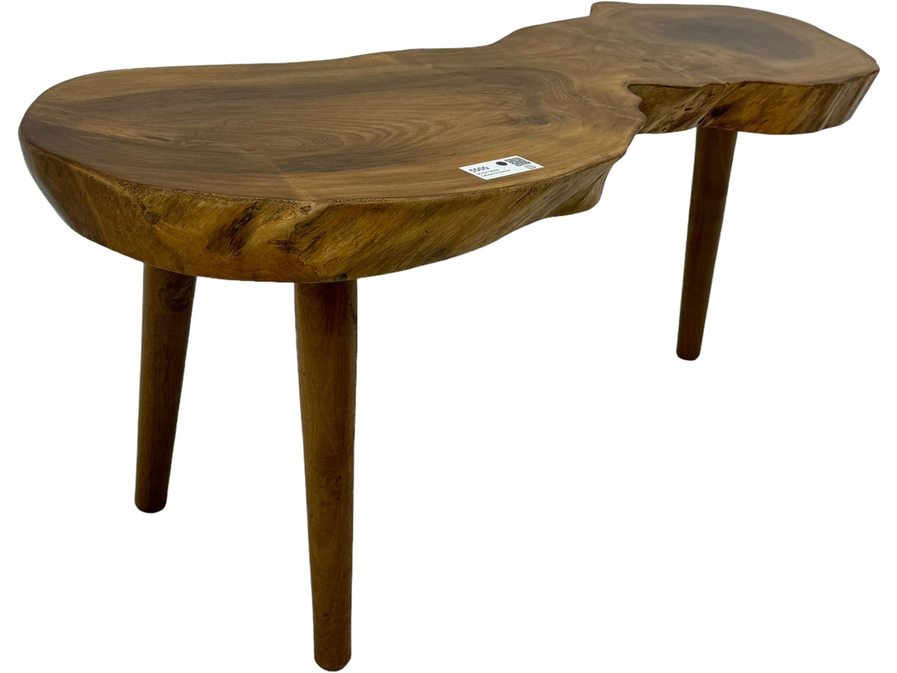 Mid-20th century live edge walnut coffee table, the top showcases the natural grain and organic form of the wood, supported by three tapered legs 