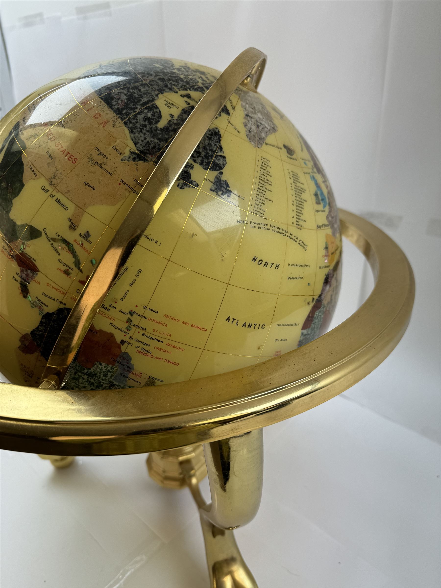 Polished gemstone terrestrial globe on gilt metal stand, H47cm