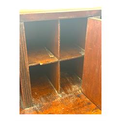 George III mahogany bureau, the fall-front enclosing fitted interior with pigeonholes and central cupboard, over an arrangement of nine short drawers surrounding a central cupboard, on shaped bracket feet