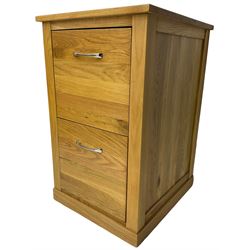 Contemporary light oak filing cabinet, rectangular top over two drawers each fitted with metal rods, on plinth base