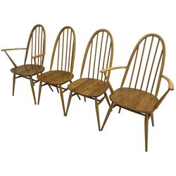 Ercol - light elm and beech set of ten (8+2) 'Quaker Windsor' dining chairs, high hoop and stick back over splayed supports united by H-stretcher, with foliate patterned crimson loose seat cushions