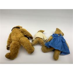 Three English teddy bears comprising 1930s Merrythought with kapok filled bright golden mohair body, swivel jointed head with glass eyes and vertically stitched nose and mouth and jointed limbs with felt paw pads H18