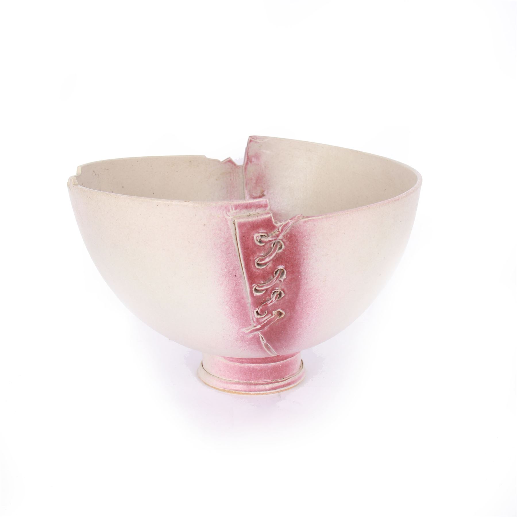 David Roberts (British 1947-): Studio pottery bowl 'Lace & Landscape', a footed bowl with laced sides and a shaped landscape rim upon a circular foot, finished in a pale pink glaze with darker pink highlights, H23cm, D32cm