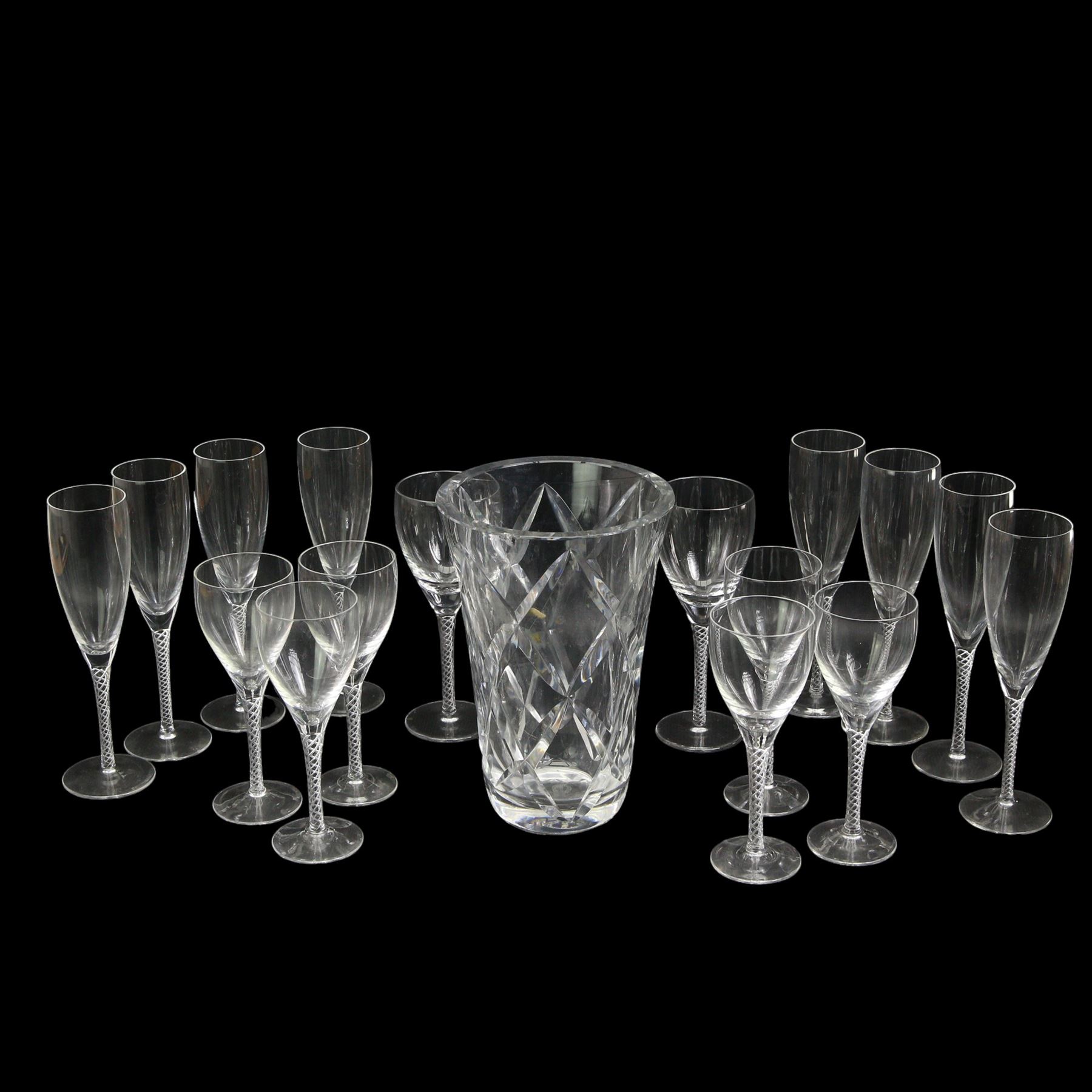 Part suit of Stuart Ariel drinking glasses comprising eight champagne flutes, six white wine glasses and two red wine glasses, together with a Saint Louis heavy cut glass vase, H25cm