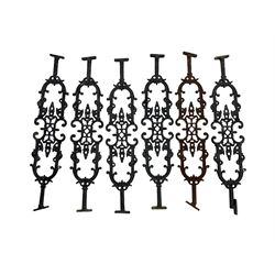 Set of twelve 20th century cast iron staircase baluster rails or balustrade, decorated with foliate scrolls