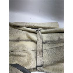 White pony hide, with grey leather sleeves and silk liner