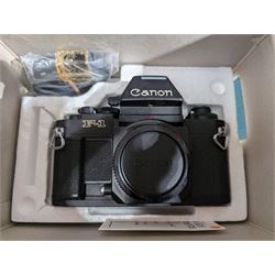 Canon F-1 SLR camera body serial no. 300461, boxed, together with thirteen Canon camera lenses, mostly FD, including 300mm 1:4 serial no. 18864, 100-300mm 1:5.6 serial no. 24187 and 200mm 1:2.8 serial no 16443, and three boxed FD extension tubes, some boxed