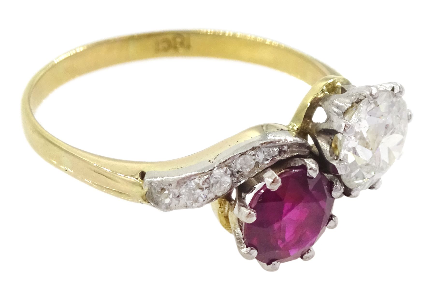 Early 20th century gold old cut diamond and ruby crossover ring, with diamond set shoulders, stamped 18ct, diamond approx 0.70 carat, ruby approx 0.75 carat