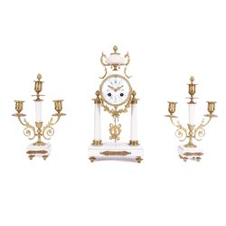 French - Louis XV style white marble and gilt mounted 8-day portico clock garniture c1905, drum movement surmounted by an oval shaped urn, supported on a pair of tapered column supports and raised on a rectangular plinth base, white enamel dial with floral garlands and Arabic numerals, Louis XV style gilt hands within a glazed bezel, twin train countwheel striking movement, striking the hours and half hours on a bell, with a pair of conforming three light candelabra, decorative matching pendulum and key.