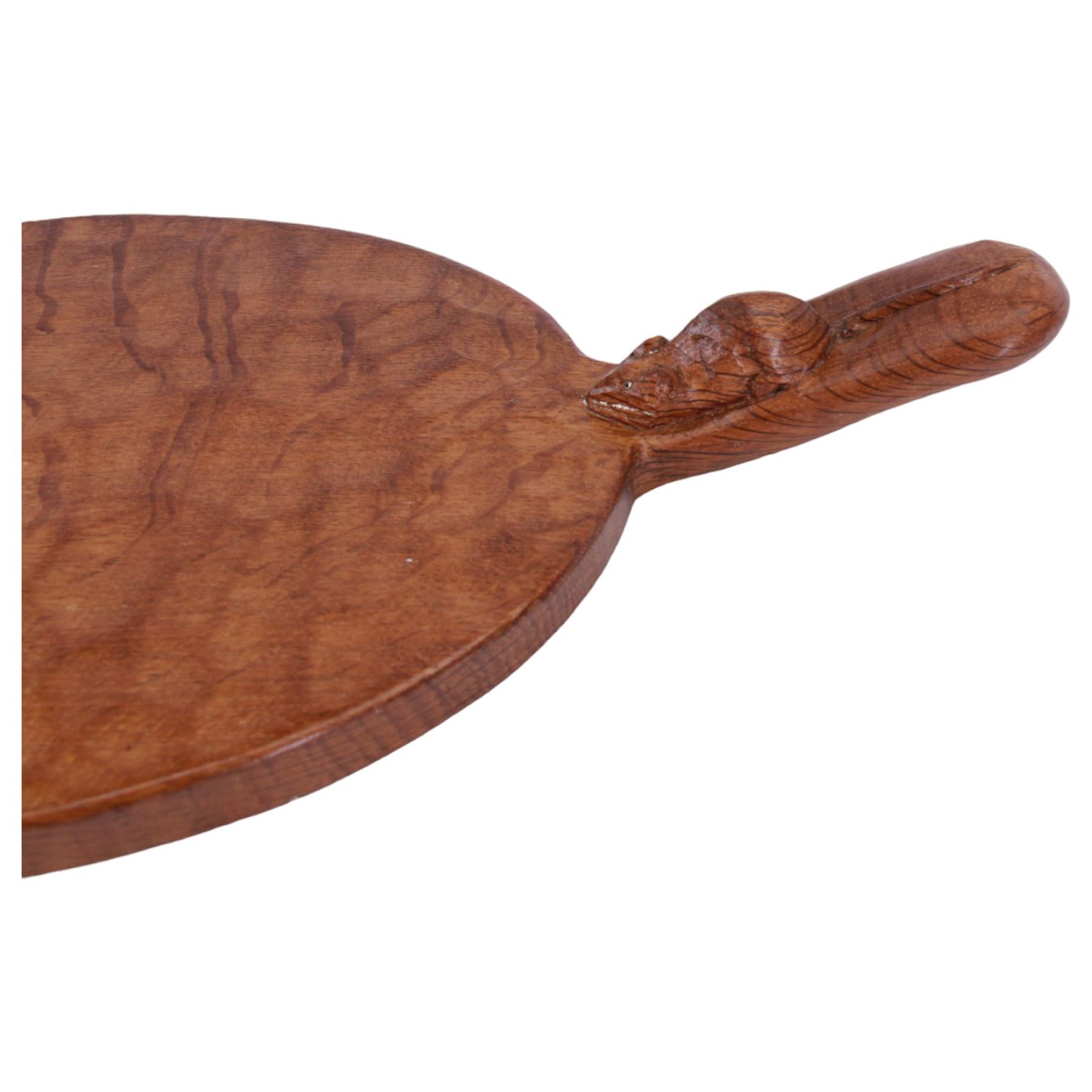 Mouseman - tooled oak cheeseboard, oval form with projecting handle carved with mouse signature, by the workshop of Robert Thompson