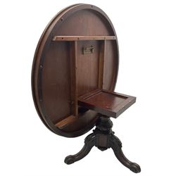 Victorian mahogany breakfast table, the circular tilt-top on carved pedestal, three moulded supports carved with bellflowers and scrolled terminals 