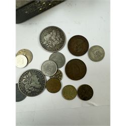 Various coins and banknotes including two Morgan dollars, in a vintage tin