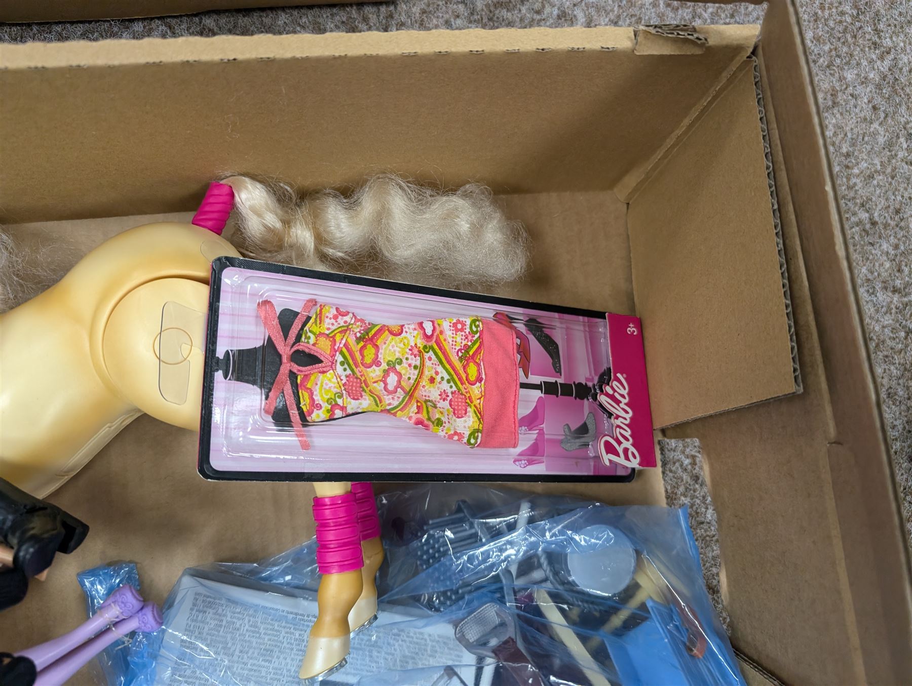 Collection of Barbie dolls, clothes, horse, stable and accessories, including, together with a Mattel Barbie yellow Volkswagen Beetle, with mobile phone remote control