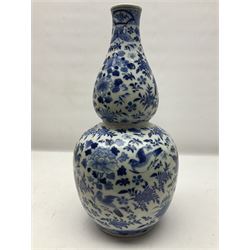 19th century Chinese blue and white double gourd form vase, decorated with blooming peonies and birds in flight, H36cm