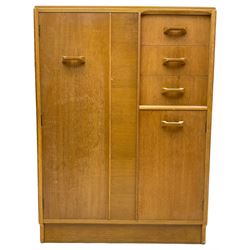 G-Plan - mid 20th century teak tallboy or combination wardrobe, left side with full-height hanging cupboard, right side with three drawers, the top fitted with vanity mirror, above cupboard with shelves, raised on a plinth base