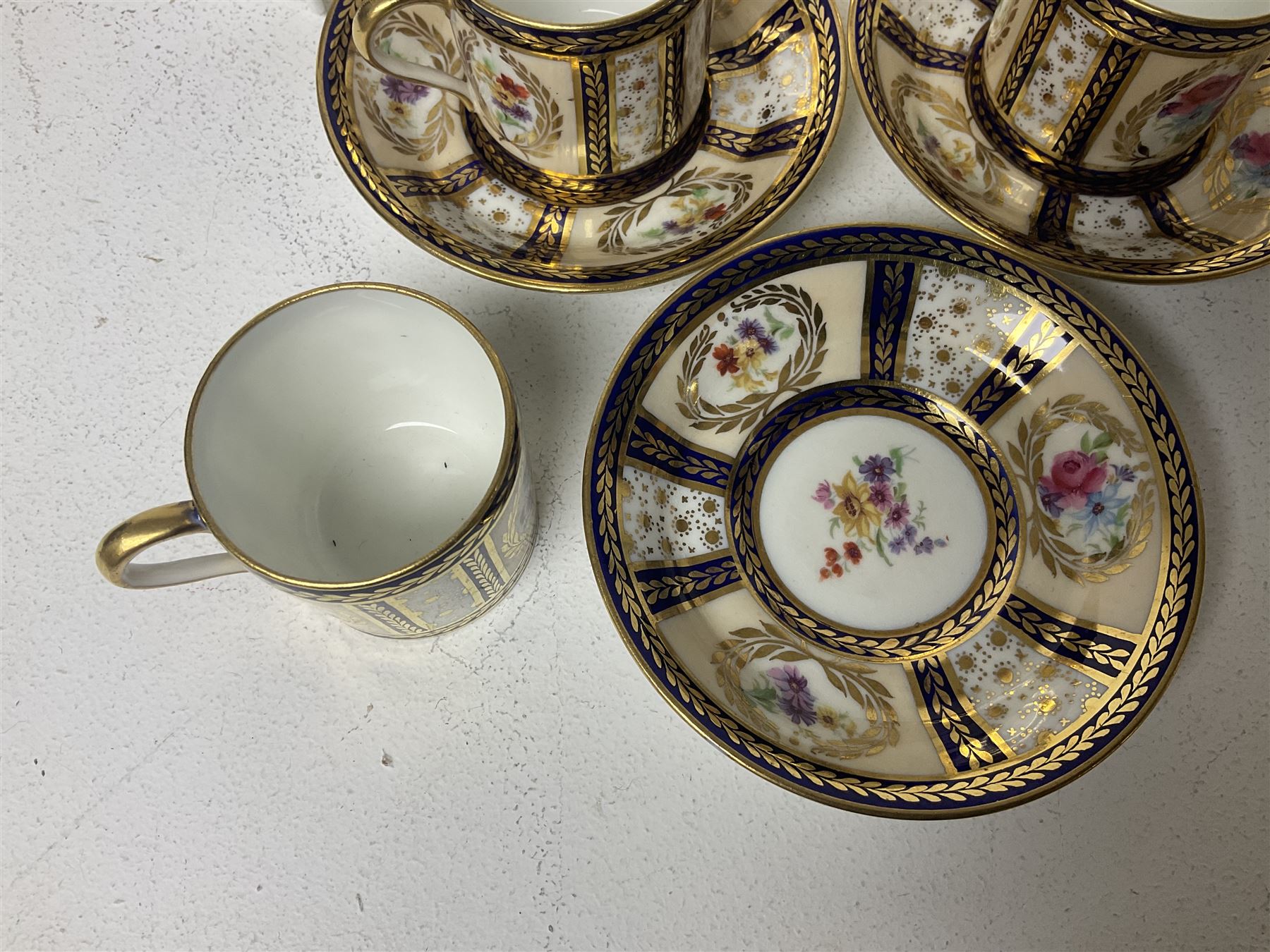 Paragon thee coffee cans and saucers, painted in gilt and colours with flowers, Paragon set of six coffee cups and saucers, 'Reproduction of Service accepted by Her Majesty Queen on her visit to the potteries, with three matching saucers