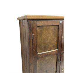 Victorian stained pine cupboard, fitted with two panelled doors with chamfered rails enclosing three shelves