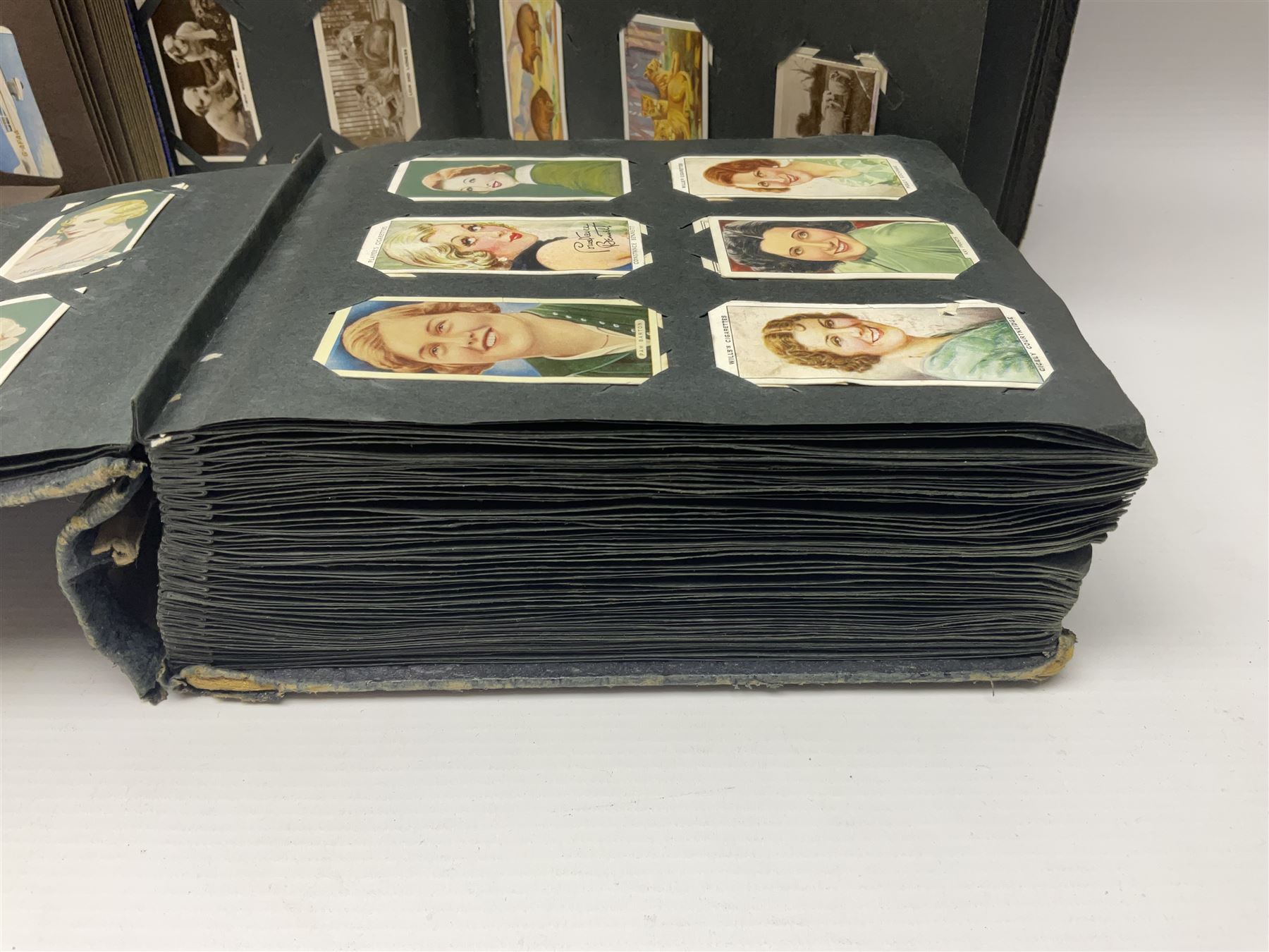 Four albums of cigarette cards, including Will's and Player's examples