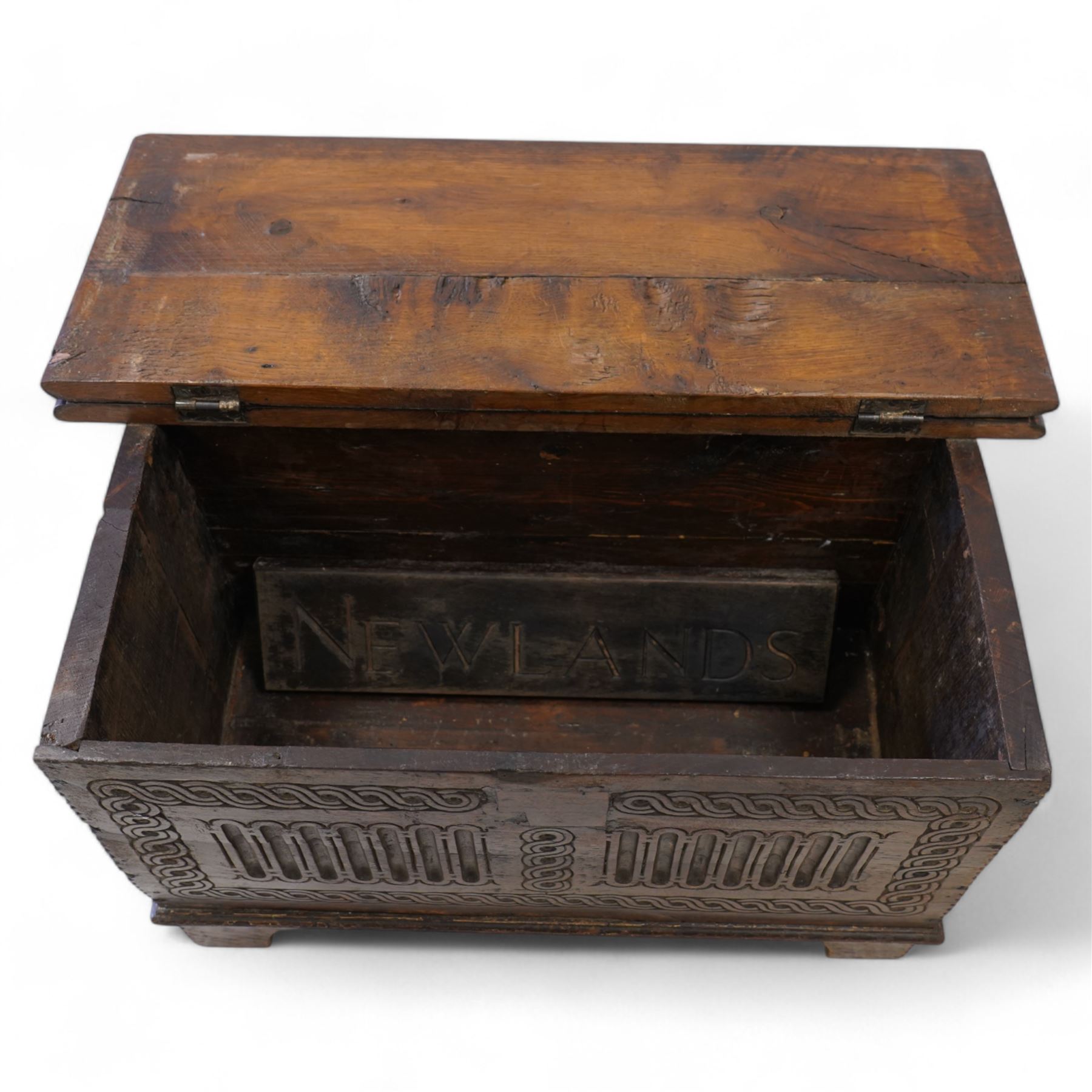 18th century and later plank kist, rectangular form, moulded hinged lid over guilloche and fluted front with chip carved edge, on bracket feet 