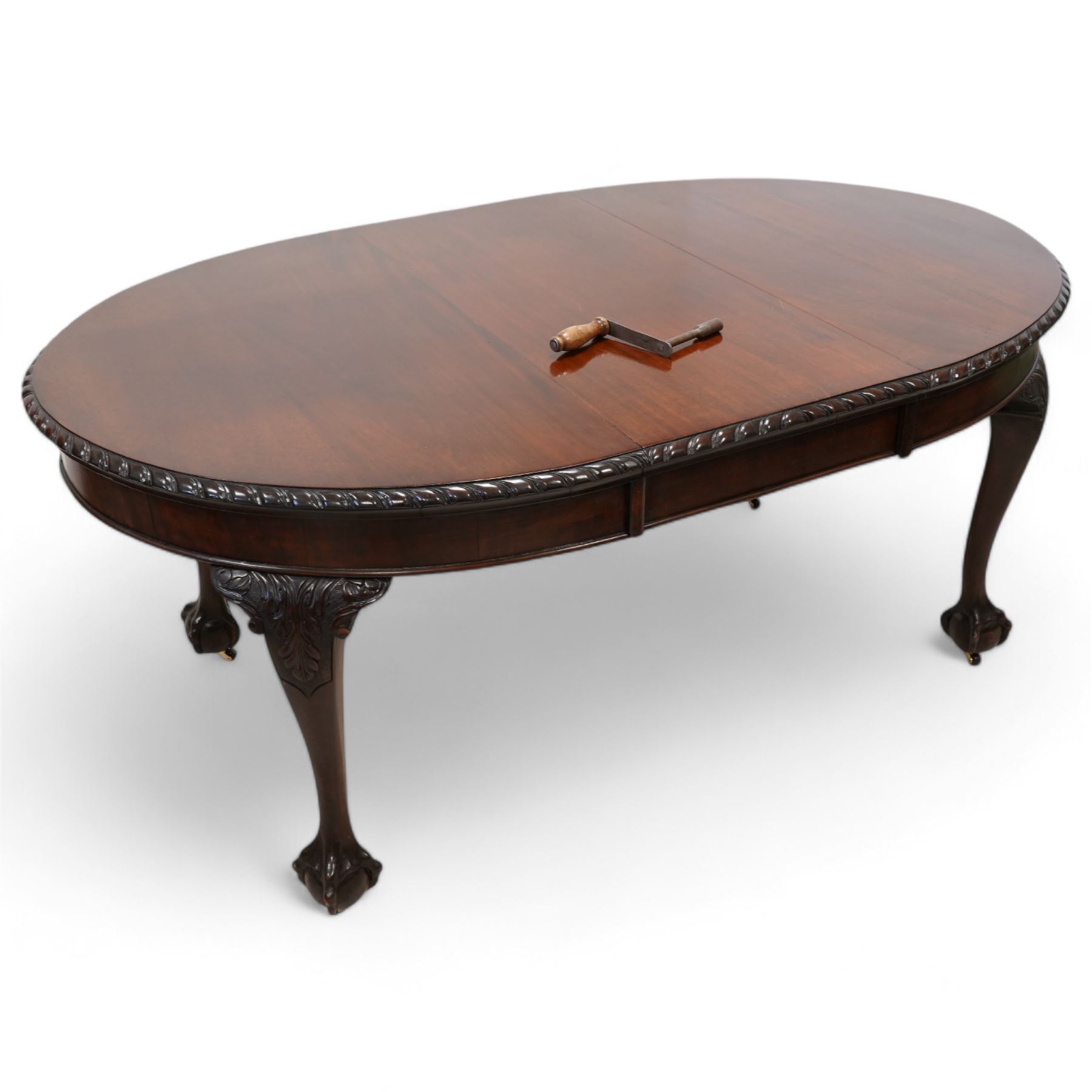 Early 20th century mahogany telescopic extending dining table, oval extending top with gadroon carved edge, single additional leaf, on acanthus carved cabriole supports with ball and claw feet 