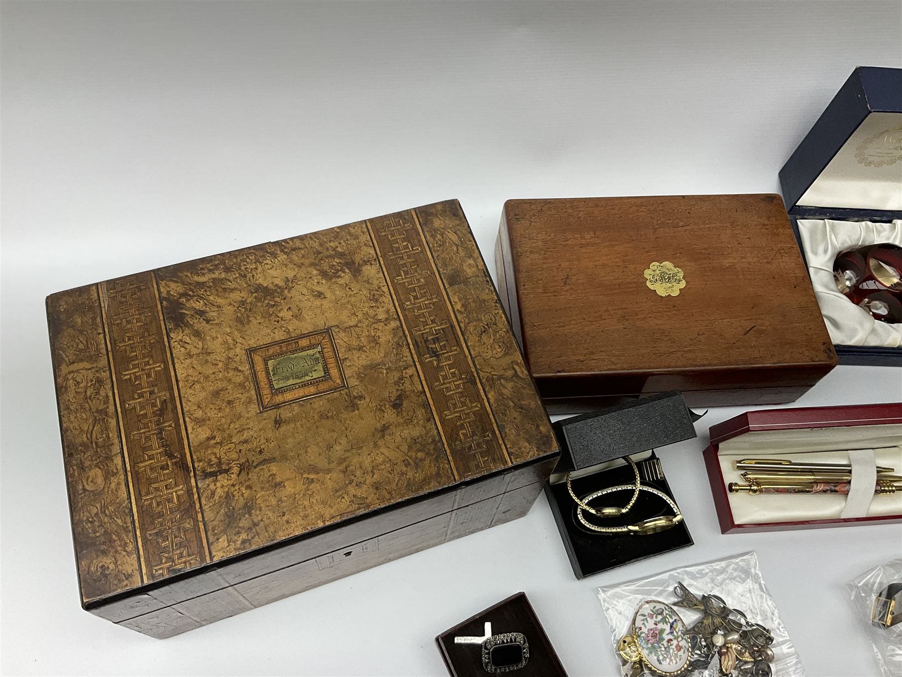 A collection of Vintage and later costume jewellery and wrist watches, to include a ladies Bulova bark effect watch, a silver brooch, hallmarked London import, boxed Webb Corbett paperweight, small Swarovski figure, together with a 19th century burr walnut box, a smaller brass bound mahogany box, etc. 