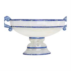 Lapis lazuli and agate twin handled pedestal bowl of navette form, the handles carved as harpies, upon a pierced oval pedestal, 19cm