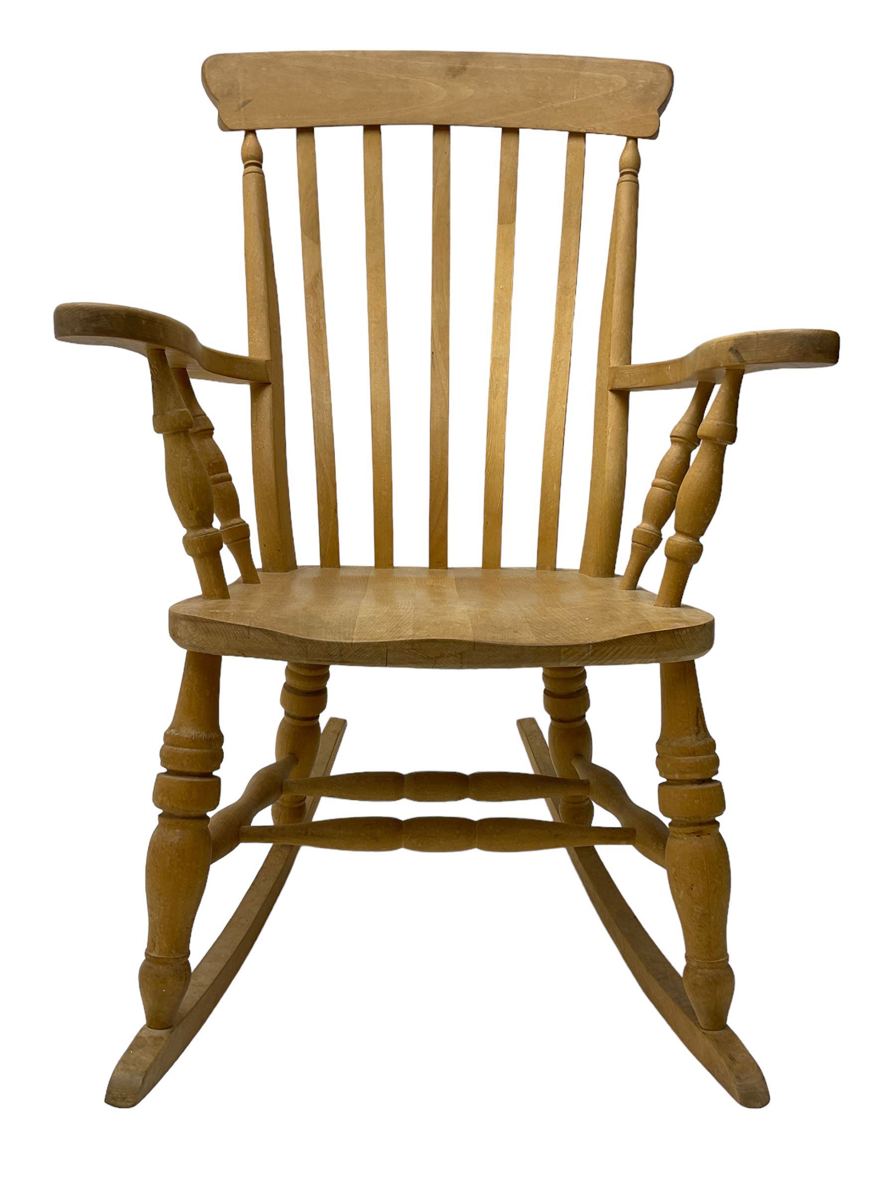 Farmhouse style beech rocking chair, shaped cresting rail on vertical slats, on turned front supports joined by swell-turned double H stretcher base