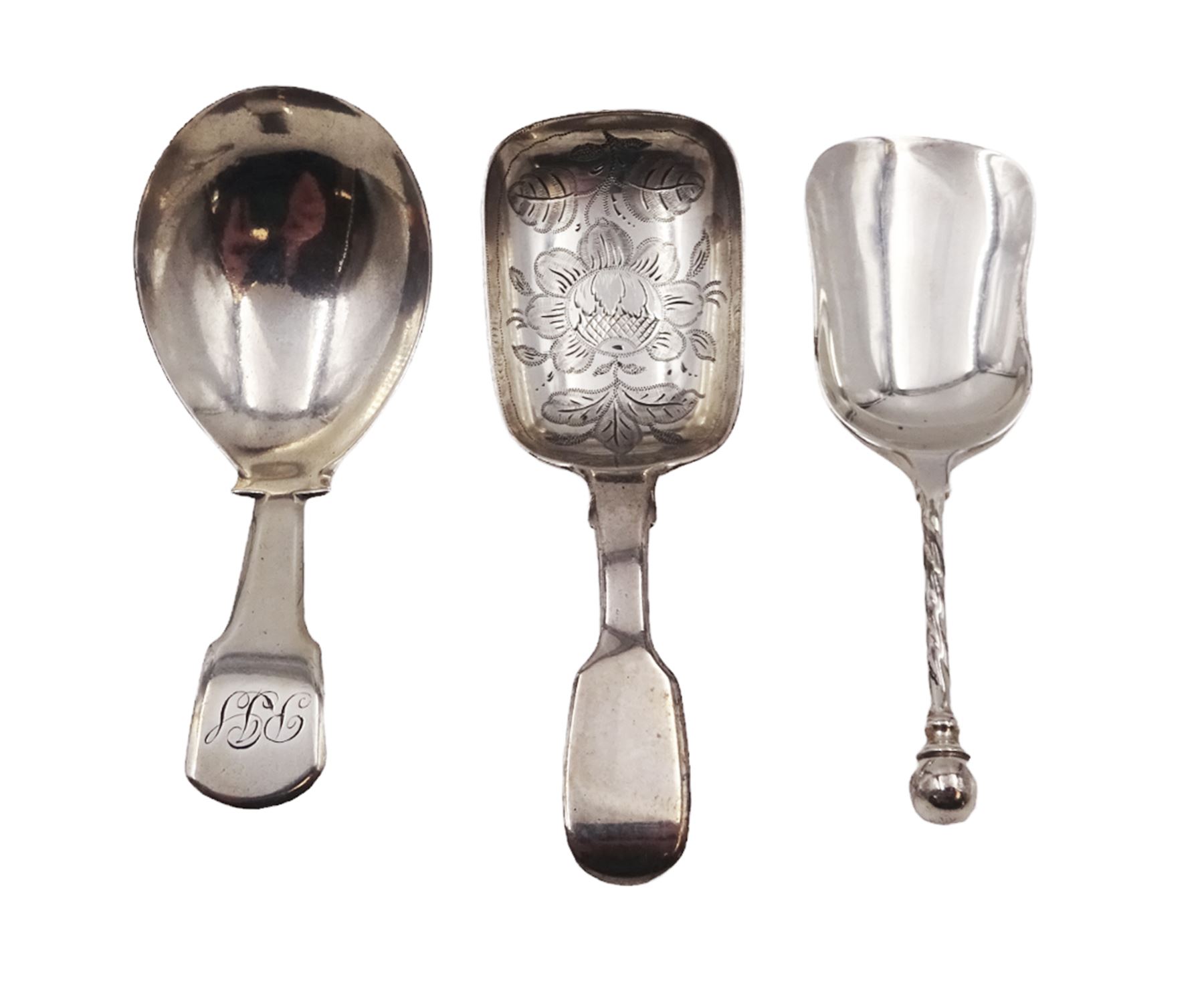 Three silver caddy spoons, comprising George III Fiddle pattern example, William IV Fiddle pattern example with later engraved bowl. and shovel example with twist handle, hallmarked some elements indistinct