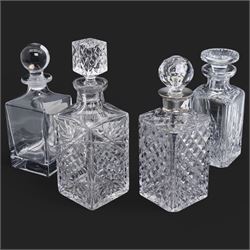 Square glass spirit decanter with silver collar and three other glass decanters