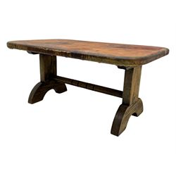 Rectangular oak coffee table, rectangular top with tan leather cover decorated with naturalistic scene, on rectangular end supports and curved feet united by turned stretcher 