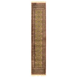 Pakistani olive and rose ground runner rug, the field decorated with repeating hexagonal m...