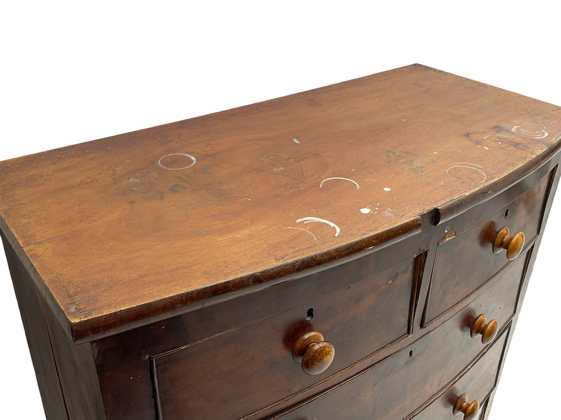 Victorian mahogany bow-front chest, fitted with two short and three long drawers, on turned feet