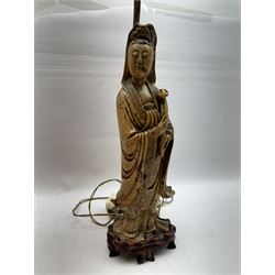 Carved soapstone lamp modelled as Guan Yin, upon hardwood base, with pink fabric shade, including shade H77.5cm