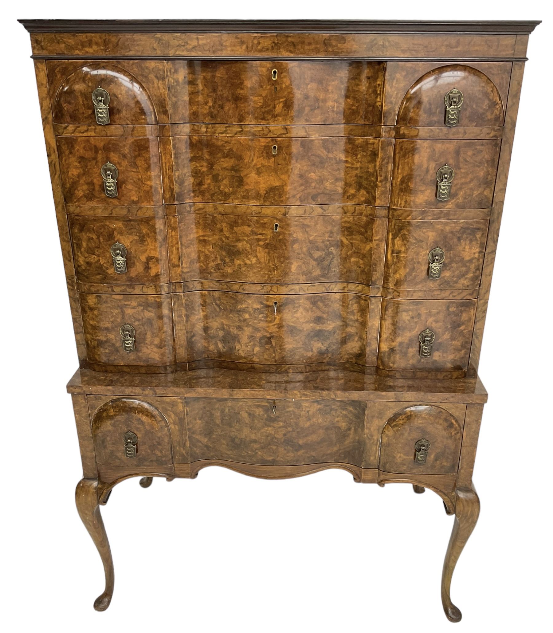 Early to mid-20th century figured walnut chest on stand, four graduating drawers on stand fitted with single drawer, drop handles in the form of shields with three recumbent lions, on cabriole supports