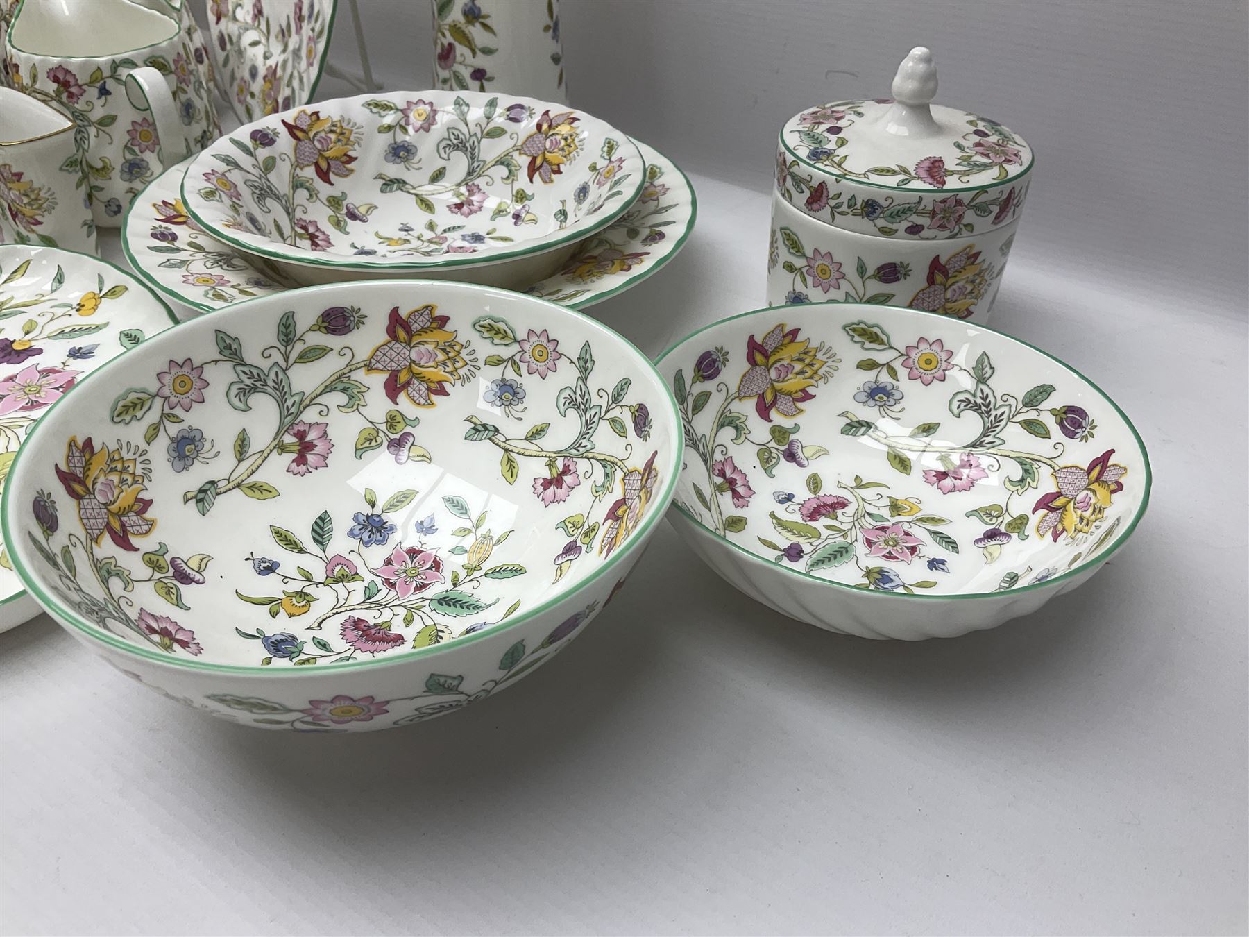 Minton Haddon Hall part tea service, including teapot, covered sucrier, milk jug, six teacups and saucers of various sizes, covered preserved jar, to vases etc (38)