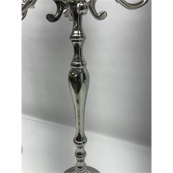 Pair of four branch candelabras, urn-shaped nozzles raised upon scroll branches supported from tapering central stem, with circular base, H70cm