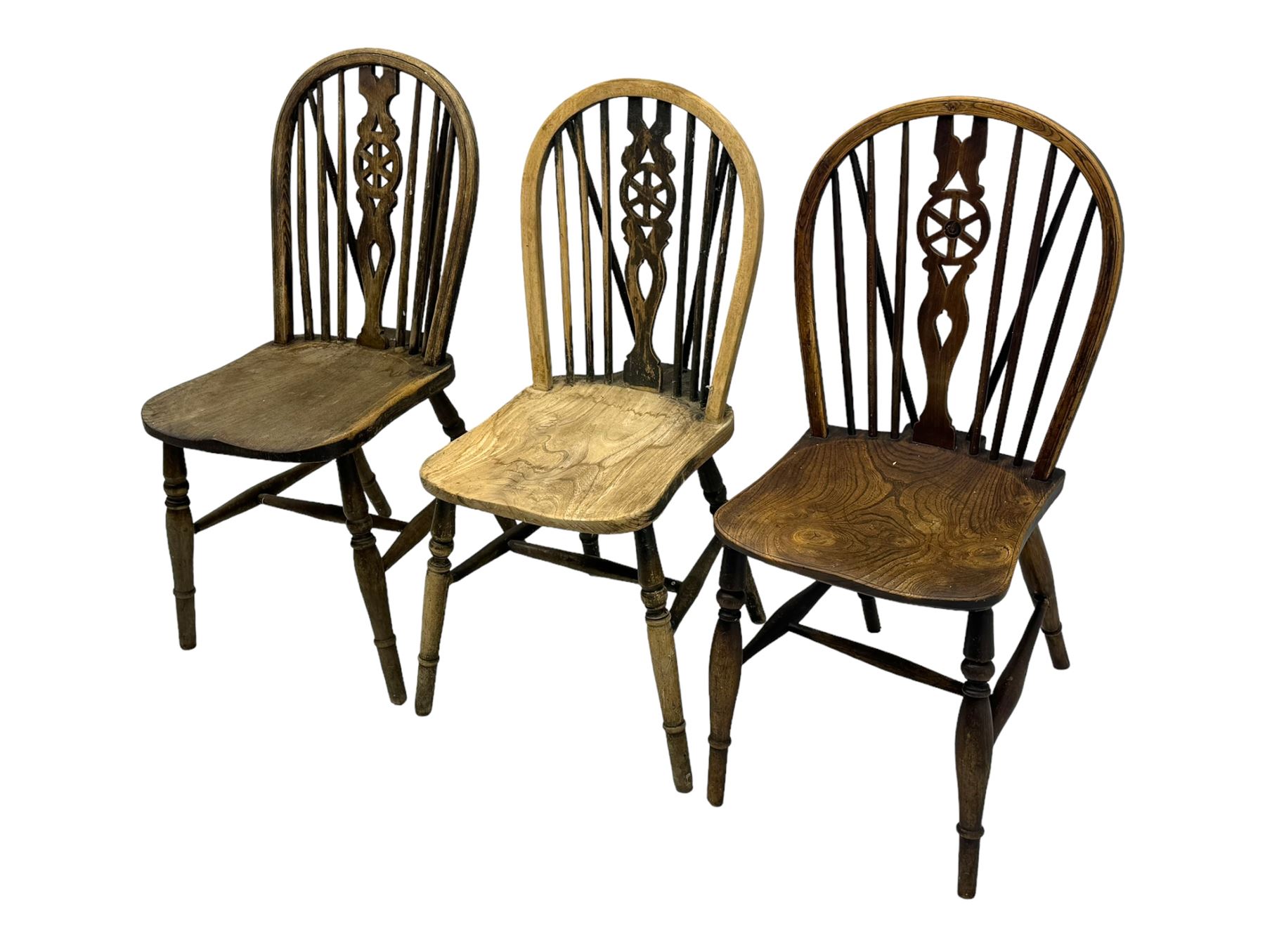 Mid-to-late 20th century set of six elm and beech Windsor dining chairs, hoop and stick back with pierced wheel splat, dished elm seat, on turned supports united by turned stretchers 