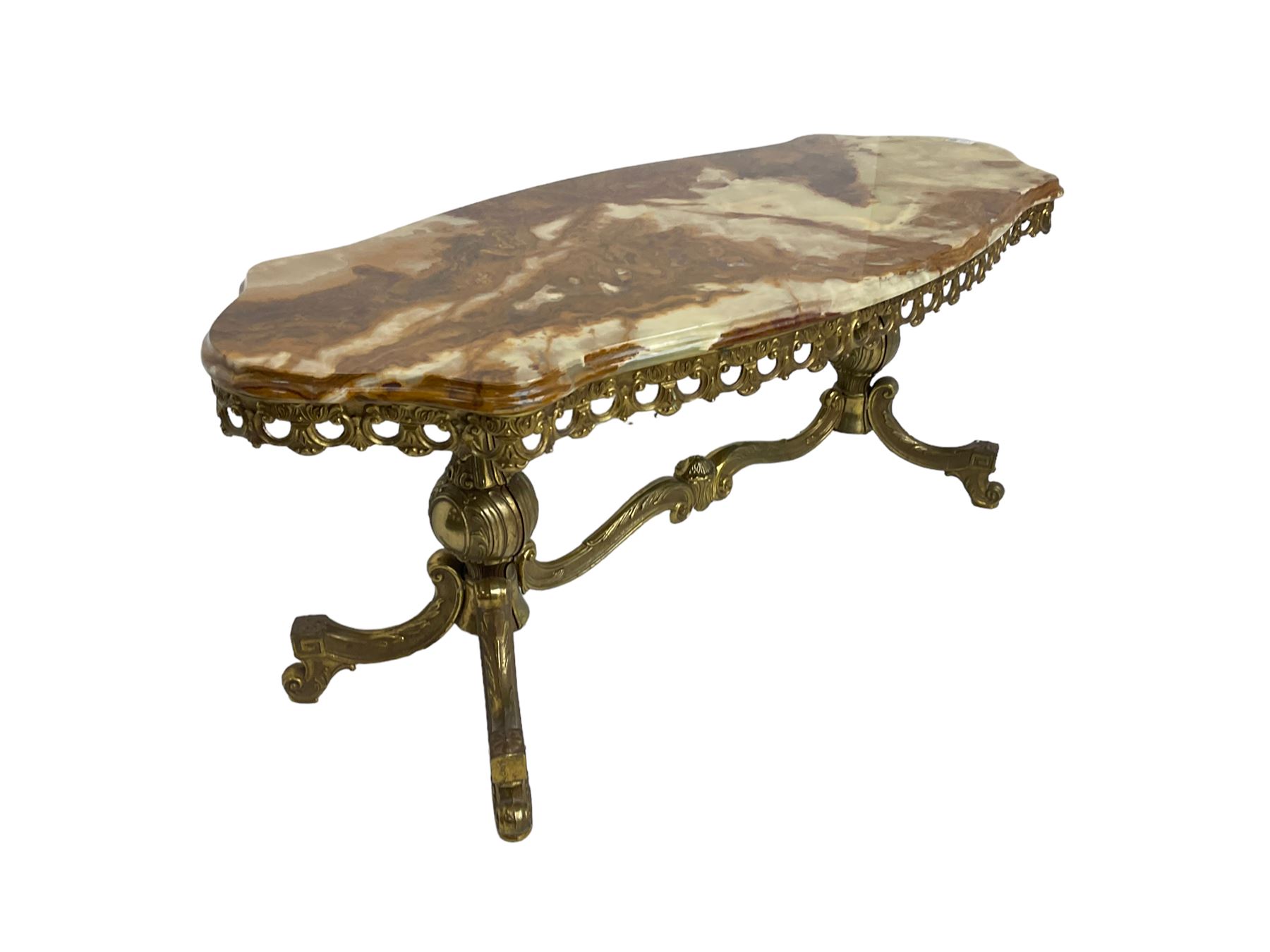 Mid-20th century Italian design Onyx and gilt serpentine coffee table, pierced gilt metal frieze with scrolling decoration, raised on twin end supports with globular turning and foliate decoration united by shaped scroll stretcher